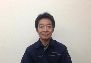作業服を着た代表取締役 小林様の写真